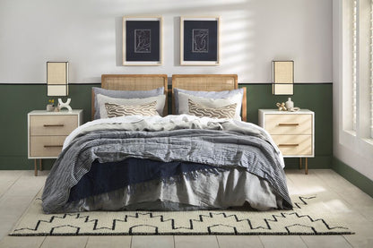 Eggshell__Top_color_is_Half_Wood_Smoke_Line_color_is_Aniseed_Lower_color_is_Bay_Leaf Bedroom with a bed, nightstands, and lamps against a green wall.